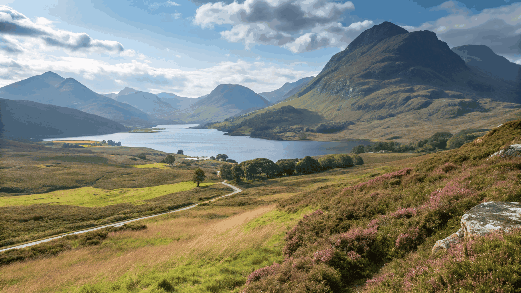 Dramatic mist over Scottish Highland mountains and deep loch