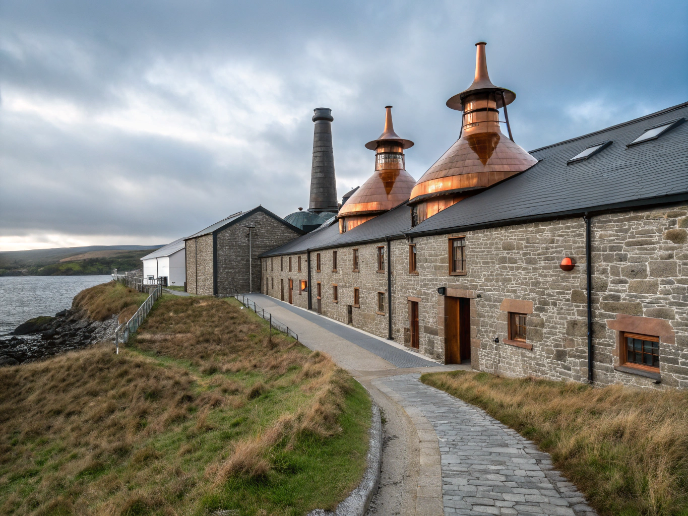 Historic stone distillery in the lush green Speyside region