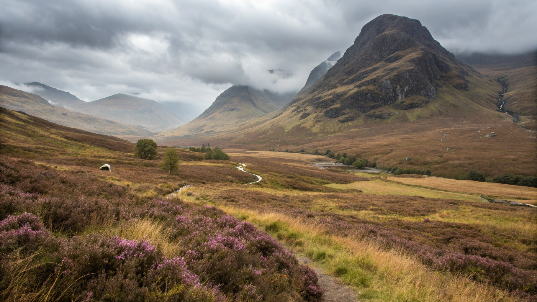 Atmospheric Isle of Skye mountains with moody clouds and green ridges